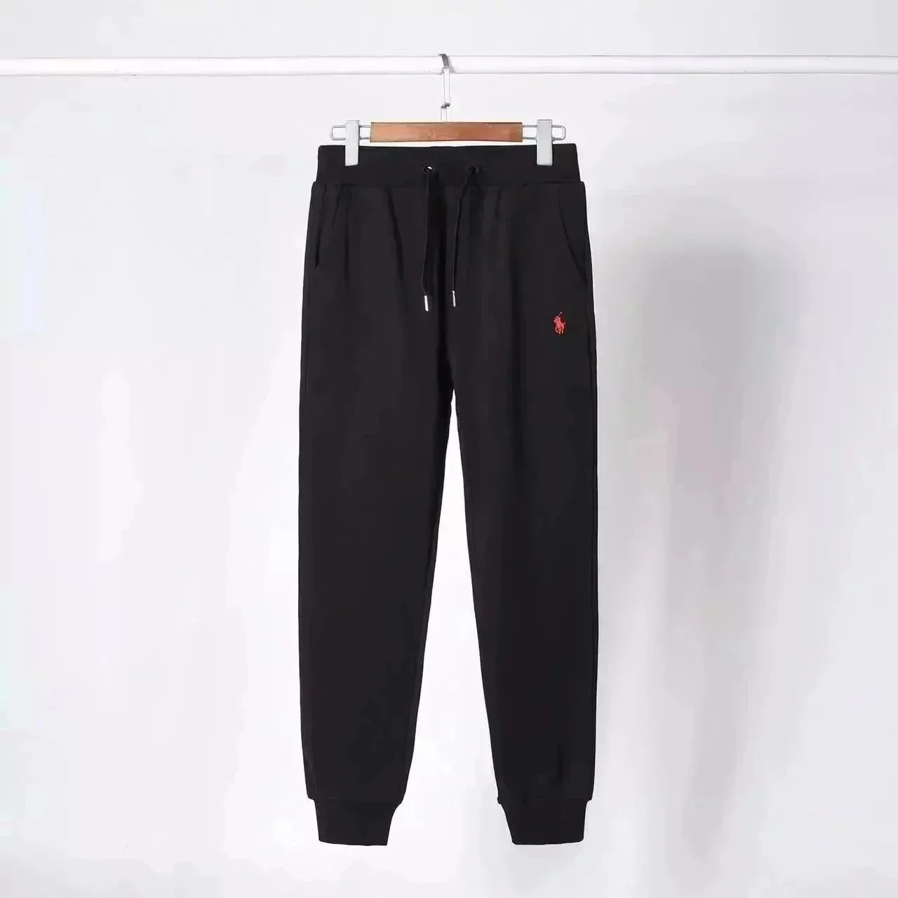 Black pants with a red label